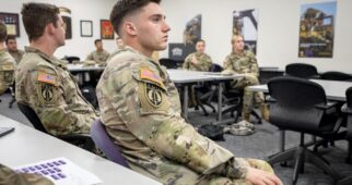 In the Rickel Building, ROTC cadets listen during an Advanced Leadership I class (MILS 40053) taught by Professor of military science LTC Kevin Nogle (not shown), November 20, 2024. Photo by Jeffrey McWhorter.