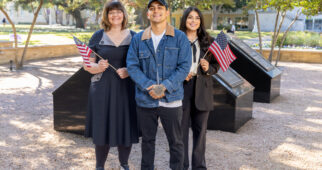 From left: Psychology professor Cathy Cox, student veteran Jose Zarate and graduate assistant Renee Castillo stand together at TCU's Veterans Plaza, November 13, 2025. Photo by Stephen Collera.